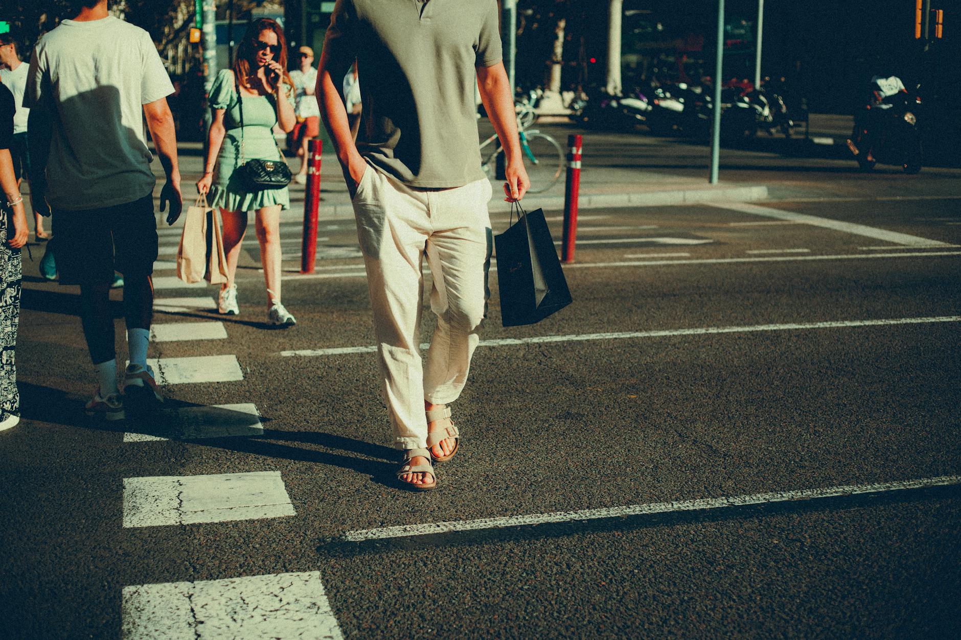 closeup of pedestrians walking on the road
