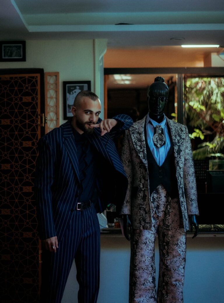 fashionable man and mannequin in stylish suits