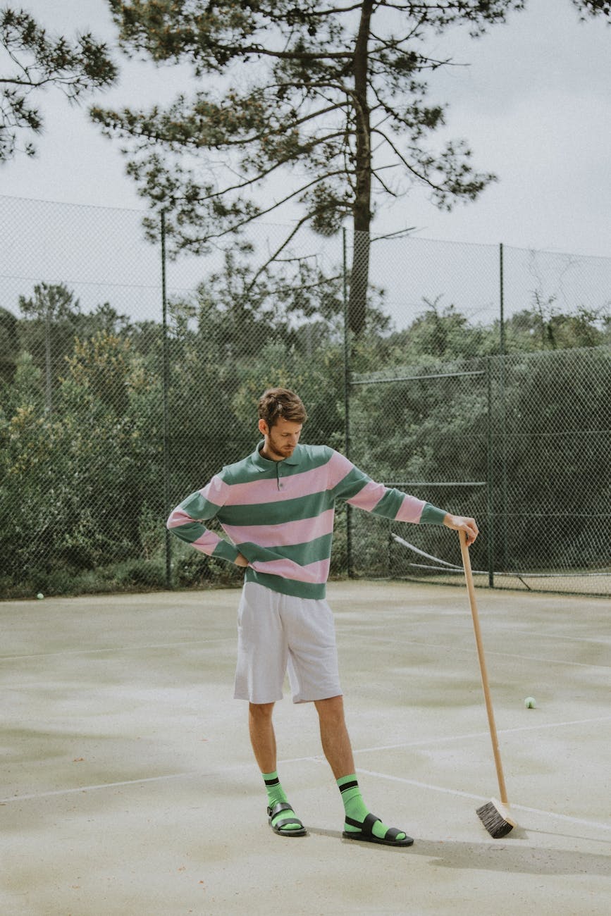a man standing on the tennis court